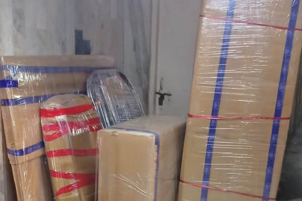 Cardboard boxes packed and labeled for home shifting